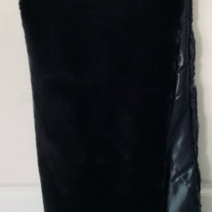 Black faux fur with Velcro closing , worn for wedding party.